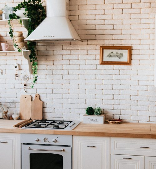 kitchen with white brick wall